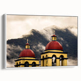 Vintage poster art of Oaxaca scenery on a large framed canvas, featuring vibrant colors against a black background.