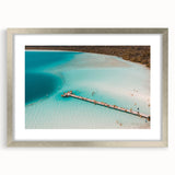 Textured abstract art print of Quintana Roo scenery in silver frame, with muted earth tones, ideal for bedroom wall decor.