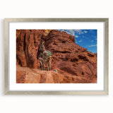 Textured abstract art print depicting a Middle Eastern landscape in muted earth tones, framed with a silver mat.