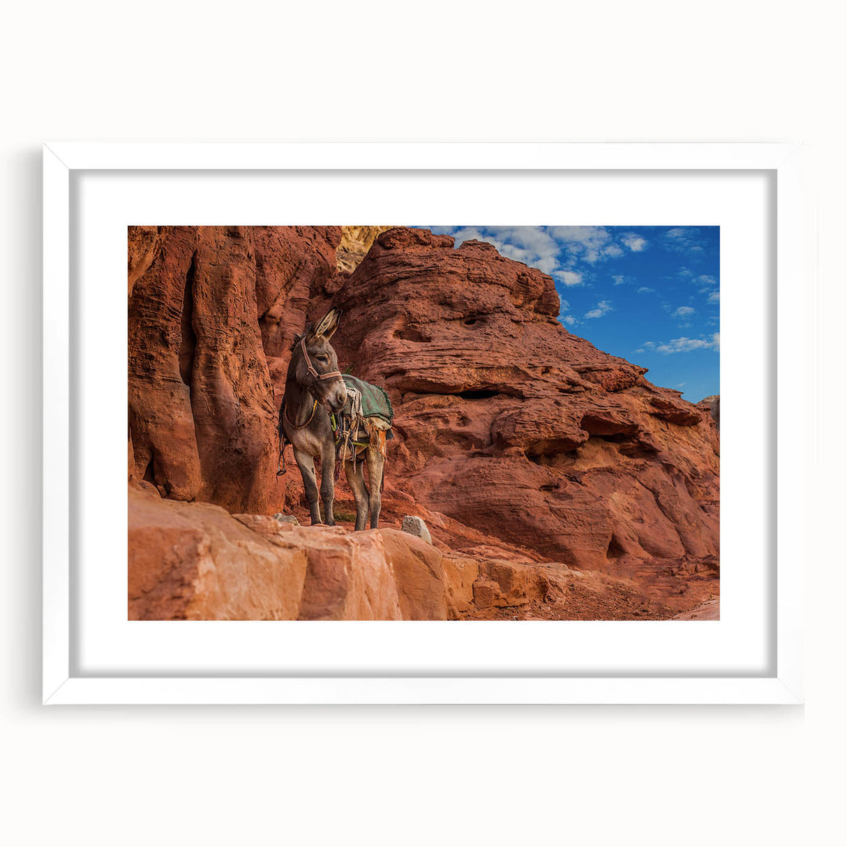 Abstract art print depicting a Middle Eastern landscape in muted earth tones, framed with a white mat.