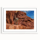 Abstract art print depicting a Middle Eastern landscape in muted earth tones, framed with a white mat.