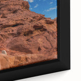Extra large framed canvas featuring a textured depiction of a Middle Eastern landscape in black with colorful accents.