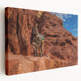 Large stretched canvas depicting a Middle Eastern Afghan landscape in earthy brown and tan tones.