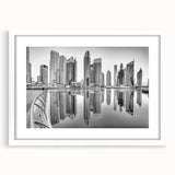 Abstract art print of Dubai skyline in muted gray and blue tones on a framed white mat, ideal for dining room decor.