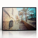 Large abstract wall art depicting a stylized Tel Aviv cityscape in muted earth tones, framed in black acrylic.