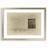 Textured abstract art print depicting a Middle Eastern scenery in muted earth tones, framed in silver, ideal for bedroom art.