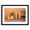 Extra large abstract art print with textured, colorful depiction of a Middle Eastern scenery on a framed black mat.