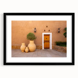Extra large abstract art print with textured, colorful depiction of a Middle Eastern scenery on a framed black mat.