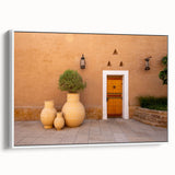 Vintage poster art of a Middle Eastern scenery in vibrant colors on a large framed canvas, ideal for living room decor.