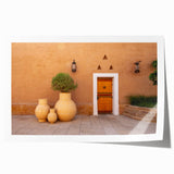 Extra large rolled print depicting a Saudi Arabian landscape with floral elements in muted earth tones.