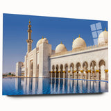 Large abstract wall art of Abu Dhabi skyline in muted blue and gray tones on acrylic glass.