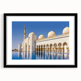Extra large, colorful abstract art print of a textured Abu Dhabi skyline, in a black frame, suitable for living room decor.