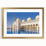 Extra large wall art featuring an abstract textured print of the Abu Dhabi skyline in muted gold and blue tones.