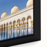 Framed canvas featuring a textured, colorful depiction of the Abu Dhabi skyline on a black background.