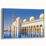 Silver-framed canvas featuring a colorful Abu Dhabi landscape with vintage poster art style, ideal for living room decor.