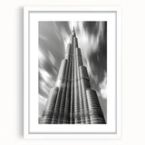 Abstract art print of the Burj Khalifa in muted gray and blue tones, framed with a white mat.
