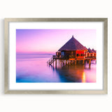 Textured art of abstract oceanic waves in blue and turquoise on a silver-framed canvas, ideal for bedroom art.