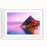 Abstract art print of Tahiti landscape in muted blue and green tones on a framed white canvas.