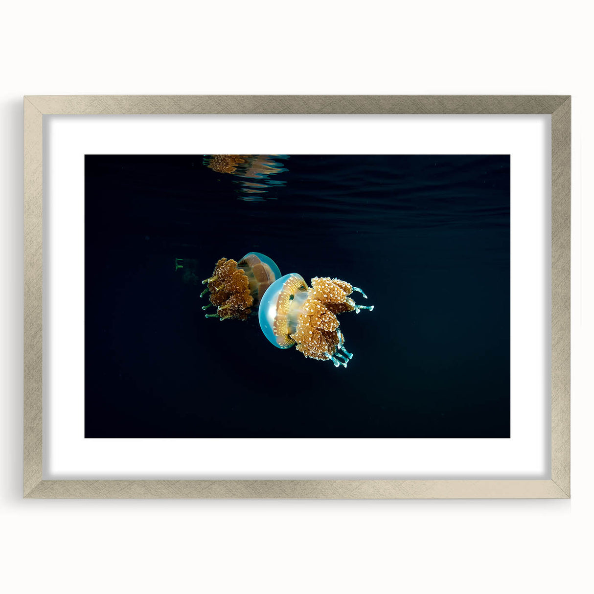 Textured abstract art print featuring muted blue and green oceanic patterns on a silver-framed canvas, ideal for bedroom art.