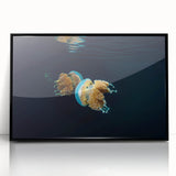 Large abstract wall art depicting a dynamic oceanic scene in cool blue and gray tones on a framed acrylic print.