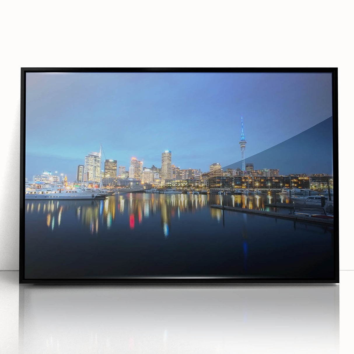Large abstract wall art depicting the Auckland skyline in muted blue tones on a framed acrylic panel.