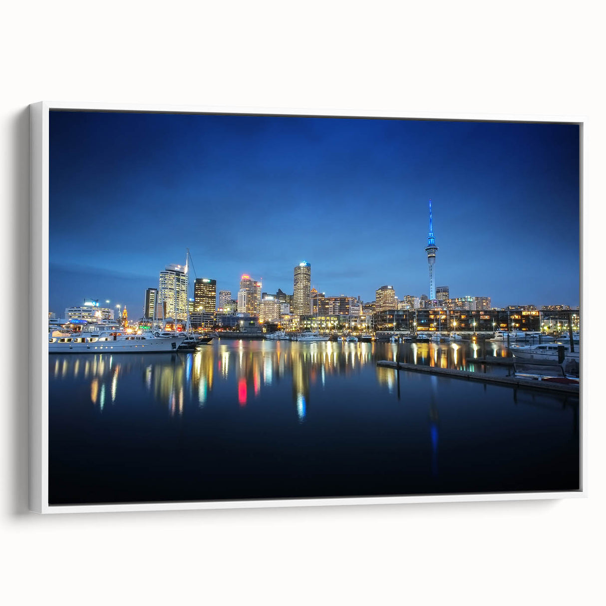 Vintage poster art of Auckland skyline in vibrant colors on a white-framed canvas.