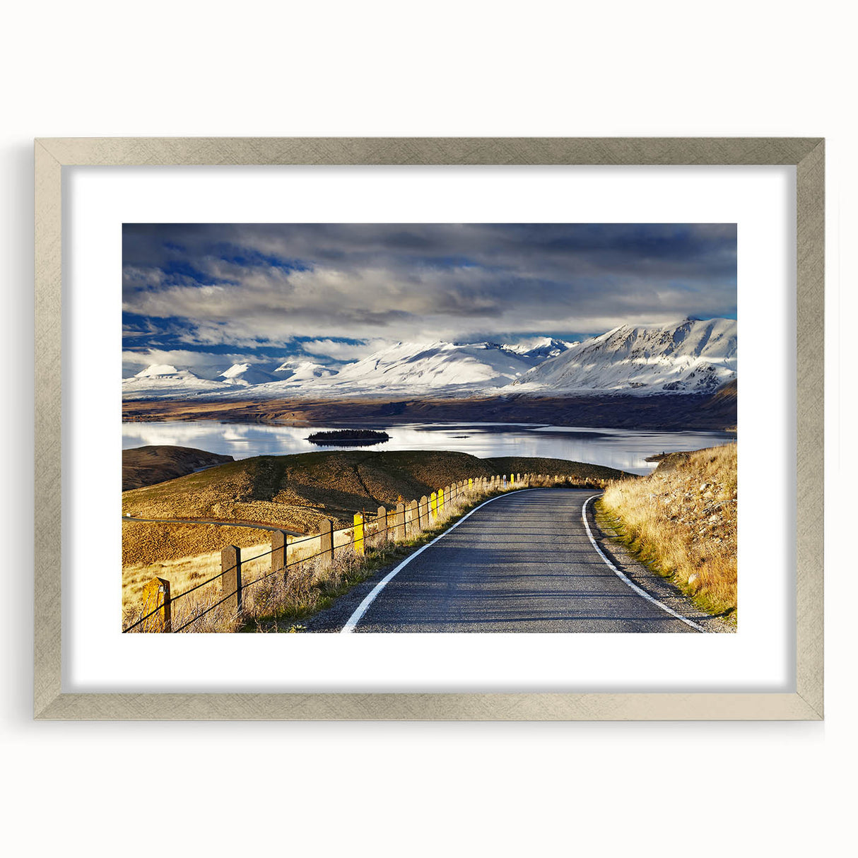 Textured art featuring abstract depiction of Canterbury, New Zealand in muted earth tones on a framed silver mat.