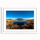 Abstract art print of Taranaki, New Zealand, in muted blue and green tones on a white framed canvas.