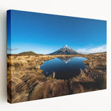 Large art print of Mount Taranaki in New Zealand with muted green and blue tones on stretched canvas.