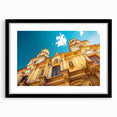 Extra large abstract art print of a colorful Buenos Aires cityscape, in a black frame with mat.