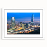 Abstract art print of Santiago skyline in muted earth tones, framed with a white mat, suitable for dining room decor.