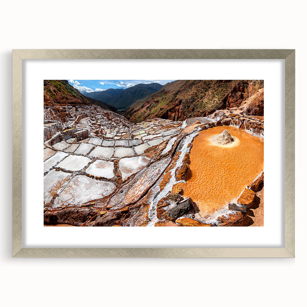 Textured art depicting an abstract Peruvian landscape in earthy tones on a framed silver mat, suitable for bedroom decor.