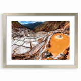 Textured art depicting an abstract Peruvian landscape in earthy tones on a framed silver mat, suitable for bedroom decor.