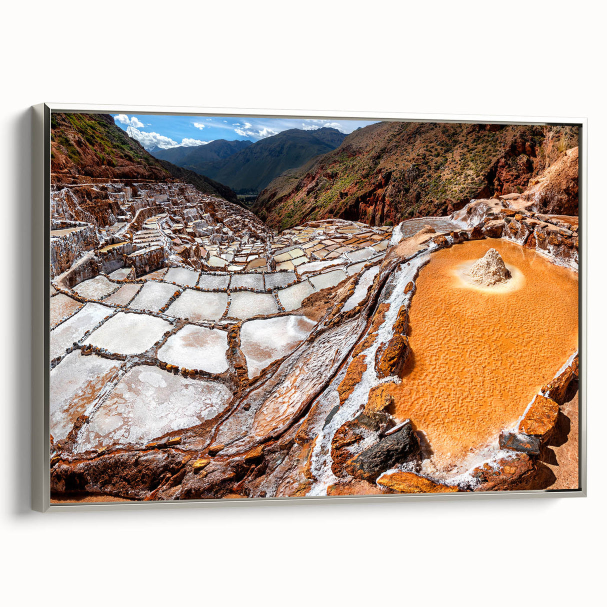 Framed canvas featuring a vintage-style landscape painting of a Peruvian scenery, with a palette of vibrant colors.