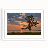 Abstract art print featuring soft blue and gray swirls on a white framed canvas, suitable for dining room or bedroom decor.