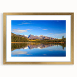 Extra large abstract art print depicting Alaskan scenery in textured tones of blue and gray, framed in gold.