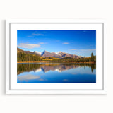 Abstract art print of Alaskan scenery in muted blue and gray tones on a framed white matte canvas.