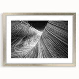 Textured art print of Coyote Buttes in Arizona, displaying earthy red and orange tones on a framed silver mat.