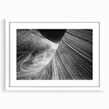 Abstract art print of Arizona's Coyote Buttes in muted earth tones on a white-framed canvas, ideal for dining room decor.