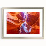 Textured art of the Grand Canyon in muted earth tones on a framed silver mat, suitable for bedroom decor.