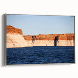Framed canvas of Lake Powell landscape art painting in vibrant blue and orange hues, ideal for living room decor.