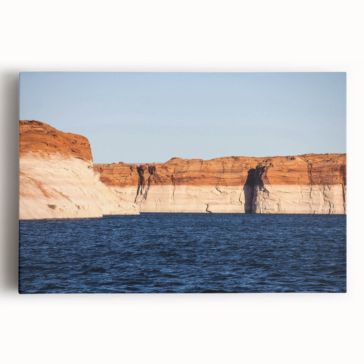 Black and white photograph of Lake Powell on stretched canvas, featuring serene water and rocky terrain.