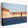 Large wall art of Lake Powell, Arizona, featuring vibrant blue and orange hues on stretched canvas.