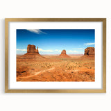 Extra large framed wall art of Monument Valley in textured gold tones, ideal for living room decor.