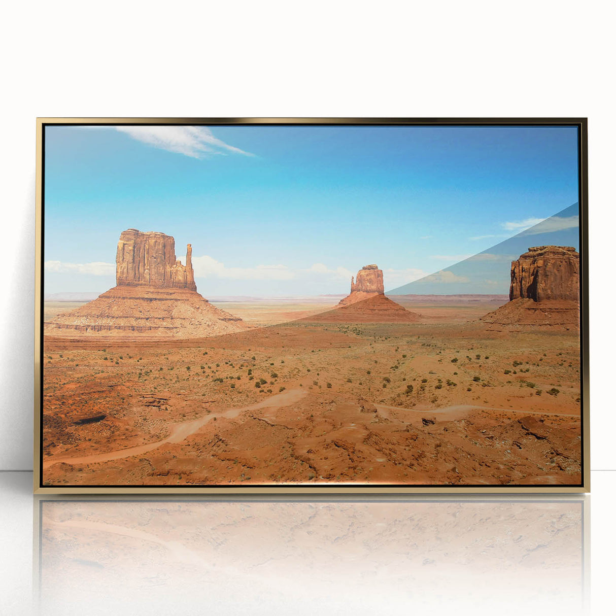 Large art print of Monument Valley in Arizona on framed acrylic, showcasing mid-century modernist style with earthy tones.