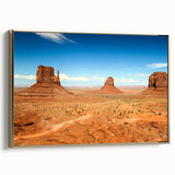 Framed canvas of Monument Valley landscape, featuring warm golden tones, ideal for bedroom wall art.