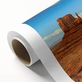 Art deco style poster of Monument Valley in muted earth tones on rolled canvas, ideal for nursery wall art.