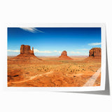 Monument Valley landscape on a rolled print, featuring earthy red and orange tones, suitable for art wall dining room.
