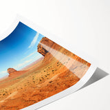 Extra large wall art of Monument Valley in Arizona, showcasing vivid red and orange tones on a rolled print.