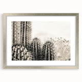 Textured art depicting abstract Sedona landscape in earth tones on a framed silver mat, suitable for bedroom decor.